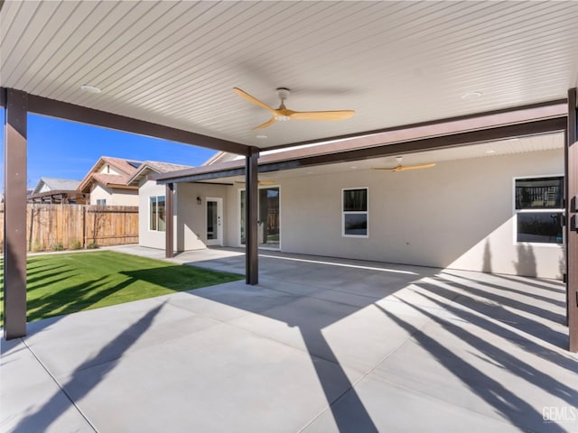 view of patio / terrace featuring fence and a ceiling fan