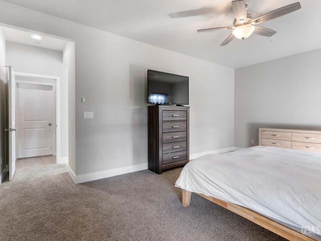 carpeted bedroom featuring ceiling fan and baseboards