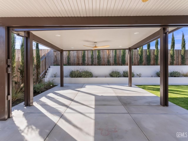 view of patio featuring a ceiling fan and a fenced backyard