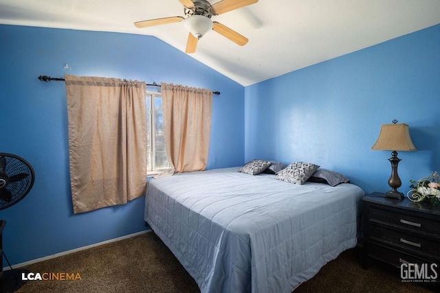 bedroom featuring ceiling fan, vaulted ceiling, and dark carpet