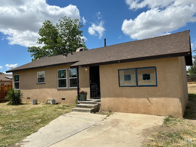 905 Hacienda Dr, Bakersfield, CA 93307 - view of front of property featuring stucco siding, crawl space, a shingled roof, and a patio area