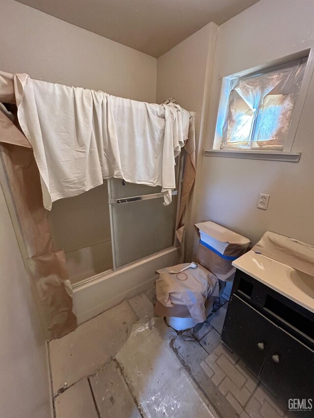 905 Hacienda Dr, Bakersfield, CA 93307 - bathroom featuring vanity and shower / bath combination with glass door