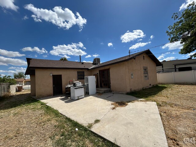 905 Hacienda Dr, Bakersfield, CA 93307 - back of house with a patio, stucco siding, and central air condition unit