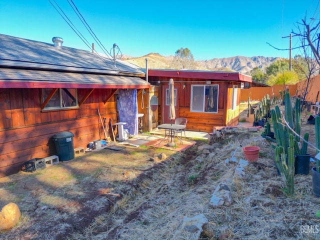 back of house with a mountain view