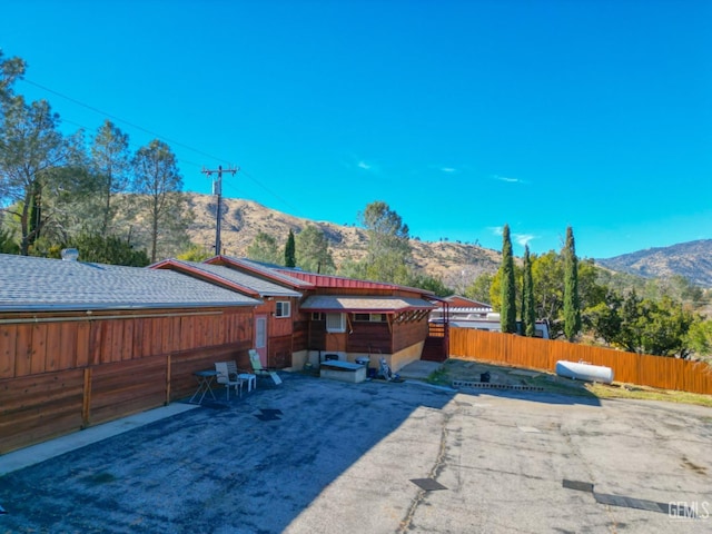 rear view of property with a mountain view