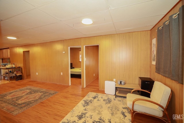 sitting room with hardwood / wood-style flooring