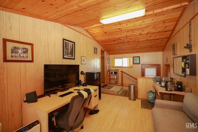 office space featuring lofted ceiling, wood walls, wooden ceiling, and light hardwood / wood-style flooring