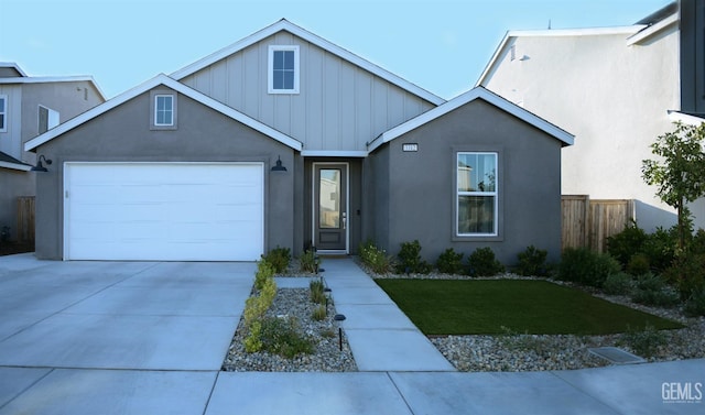 3312 Brook Grove Ln, Shafter, CA 93263 - view of front of home featuring board and batten siding, an attached garage, concrete driveway, and stucco siding