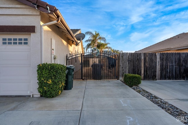 view of side of home featuring a garage