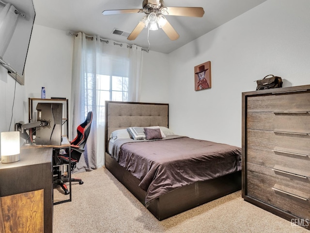 bedroom with light colored carpet and ceiling fan