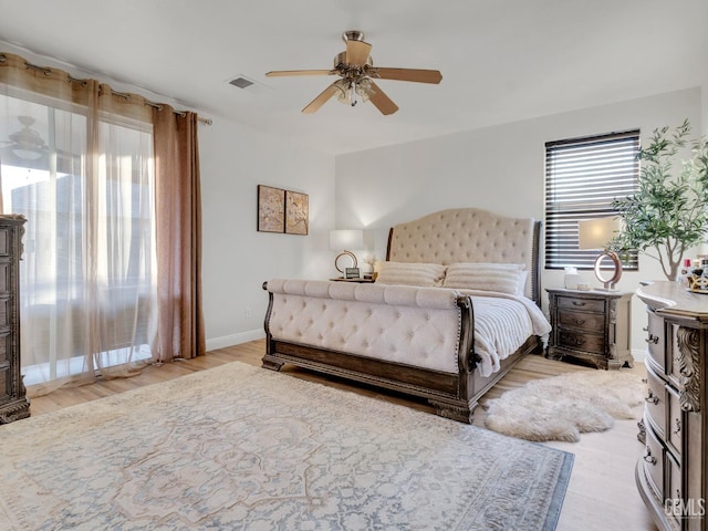 bedroom with light wood-type flooring and ceiling fan