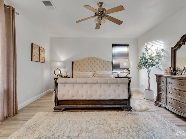 bedroom featuring light hardwood / wood-style floors and ceiling fan