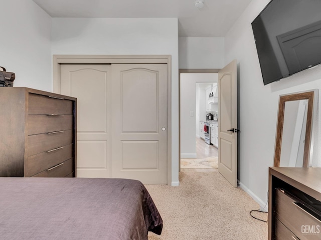 carpeted bedroom with a closet