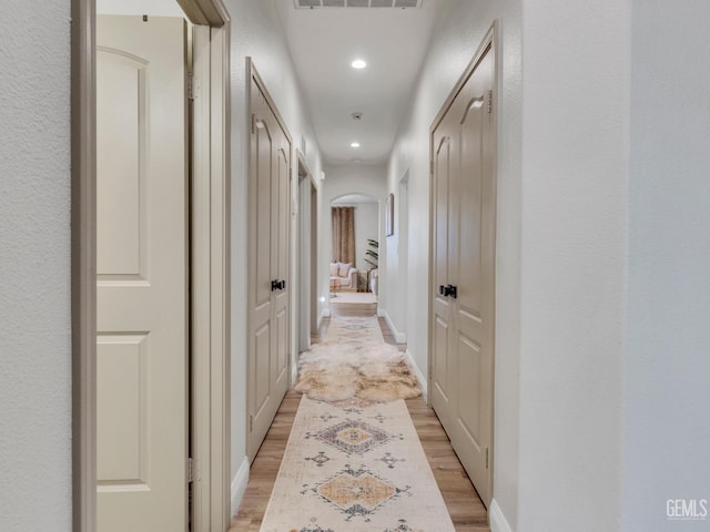 corridor featuring light hardwood / wood-style flooring