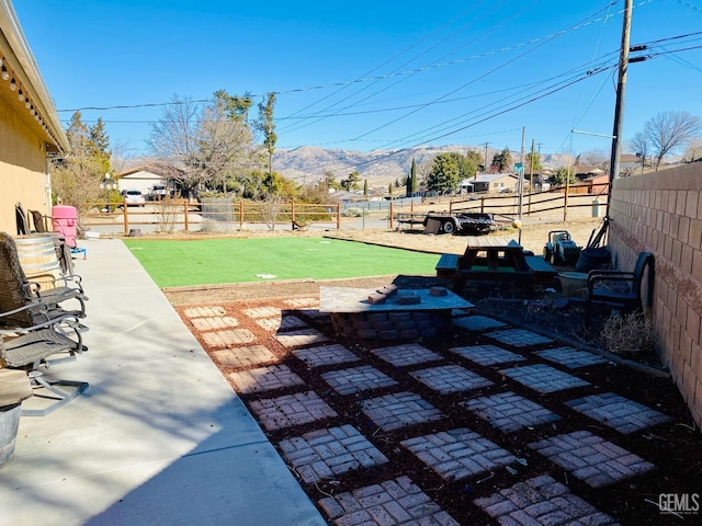 view of patio with a mountain view