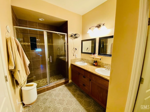 bathroom with an enclosed shower, vanity, tile patterned flooring, and toilet