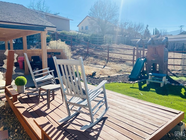 wooden deck with a playground