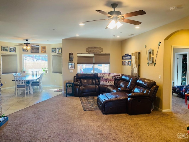 tiled living room with ceiling fan