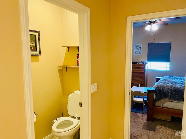 bathroom with ceiling fan and toilet