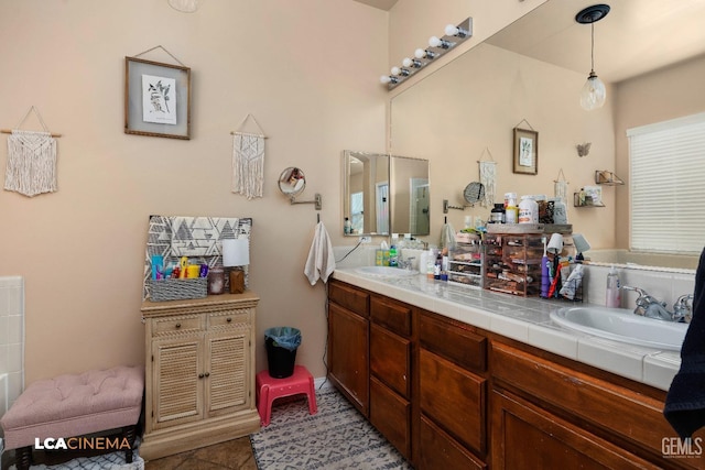 bathroom with tile patterned floors and vanity