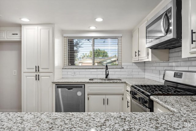 3112 Harrogate Ln, Bakersfield, CA 93309 - kitchen featuring stainless steel appliances, white cabinetry, and recessed lighting
