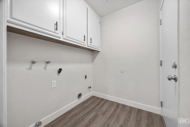 3112 Harrogate Ln, Bakersfield, CA 93309 - laundry room featuring electric dryer hookup, cabinet space, wood finished floors, gas dryer hookup, and hookup for a washing machine