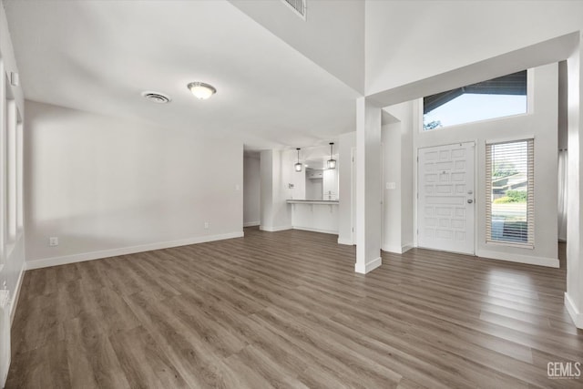 3112 Harrogate Ln, Bakersfield, CA 93309 - unfurnished living room with wood finished floors and a high ceiling