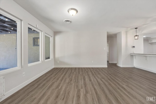 3112 Harrogate Ln, Bakersfield, CA 93309 - unfurnished living room with wood finished floors and baseboards
