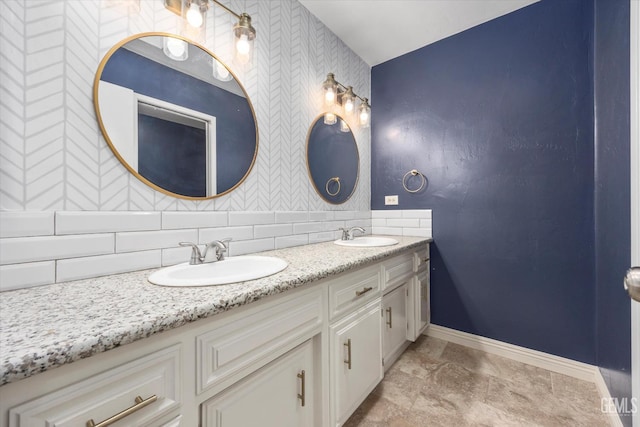 3112 Harrogate Ln, Bakersfield, CA 93309 - bathroom featuring wallpapered walls, double vanity, backsplash, and an accent wall