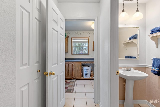 bathroom featuring tile patterned flooring and sink