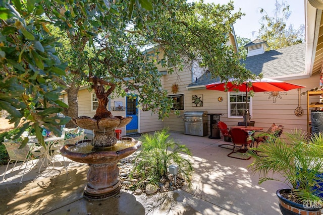 view of patio with a grill