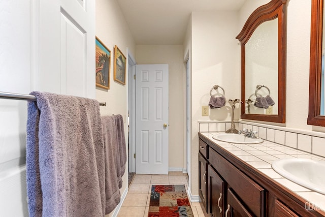 bathroom featuring tile patterned flooring and vanity