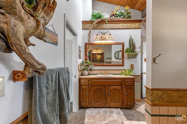 bathroom with vanity, vaulted ceiling, and wood ceiling