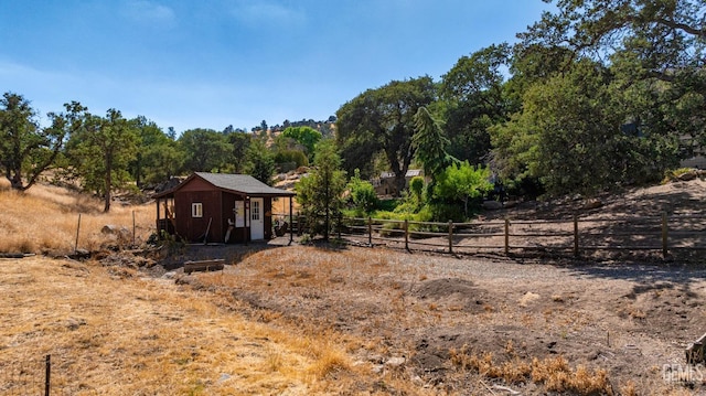 exterior space with a rural view and an outbuilding