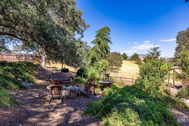 view of yard with a rural view