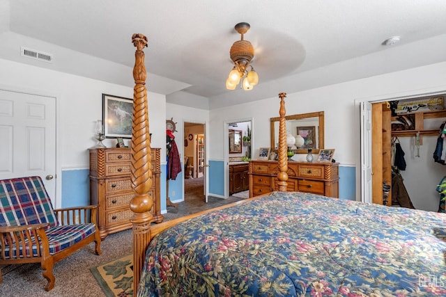 bedroom featuring dark colored carpet, a closet, and ceiling fan