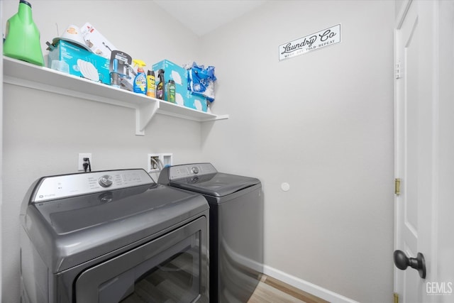 5711 Cordonata Way, Bakersfield, CA 93306 - washroom featuring washing machine and dryer, baseboards, and wood finished floors