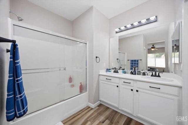 5711 Cordonata Way, Bakersfield, CA 93306 - bathroom with enclosed tub / shower combo, wood finished floors, double vanity, ceiling fan, and baseboards