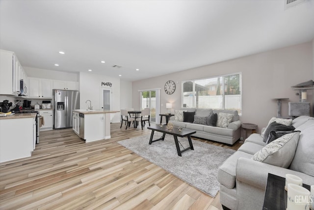 5711 Cordonata Way, Bakersfield, CA 93306 - living room with light wood-type flooring and recessed lighting