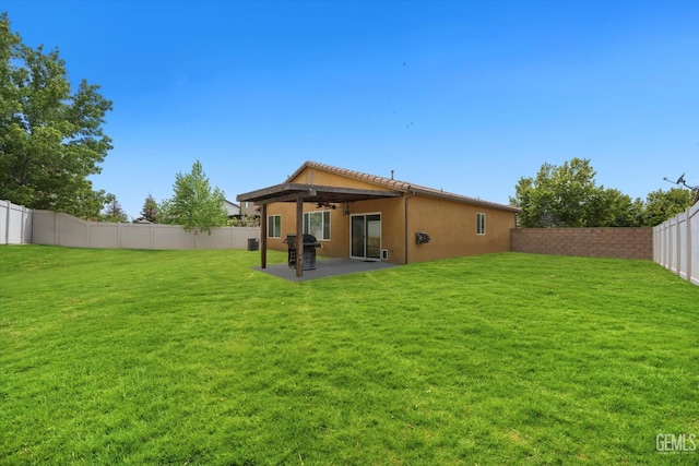 5711 Cordonata Way, Bakersfield, CA 93306 - back of property with a ceiling fan, a patio area, and stucco siding