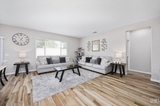 5711 Cordonata Way, Bakersfield, CA 93306 - living area with light wood-style flooring and baseboards