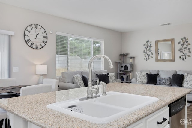 5711 Cordonata Way, Bakersfield, CA 93306 - kitchen featuring open floor plan, a sink, stainless steel dishwasher, and white cabinetry