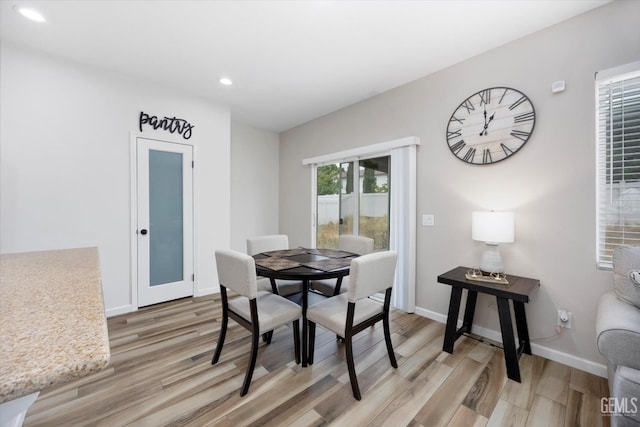5711 Cordonata Way, Bakersfield, CA 93306 - dining area with light wood-type flooring, recessed lighting, and baseboards