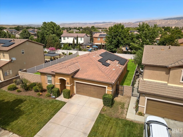 5711 Cordonata Way, Bakersfield, CA 93306 - view of front of house with a gate, a residential view, an attached garage, stucco siding, and driveway