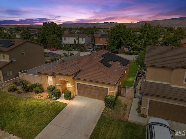 5711 Cordonata Way, Bakersfield, CA 93306 - view of front facade featuring a gate, a garage, a mountain view, concrete driveway, and stucco siding