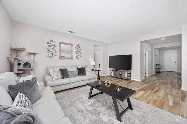 5711 Cordonata Way, Bakersfield, CA 93306 - living room with light wood finished floors and baseboards