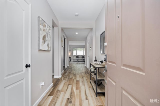 5711 Cordonata Way, Bakersfield, CA 93306 - hall featuring light wood-style flooring and baseboards