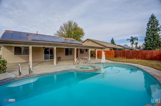 view of pool featuring an in ground hot tub and a patio