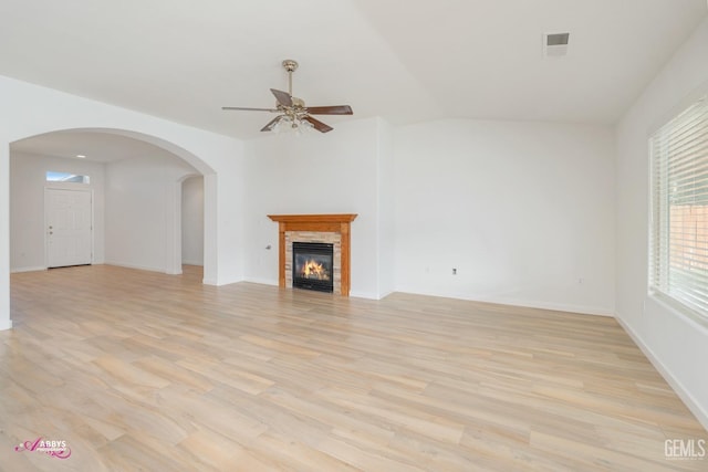 unfurnished living room featuring ceiling fan and light hardwood / wood-style flooring