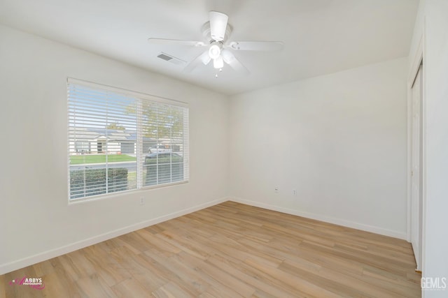 empty room featuring ceiling fan and light hardwood / wood-style flooring